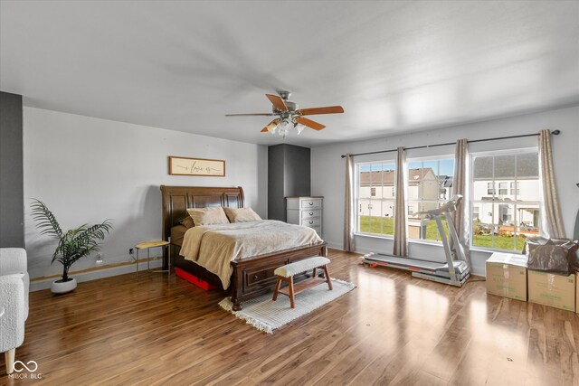 bedroom featuring ceiling fan and wood-type flooring