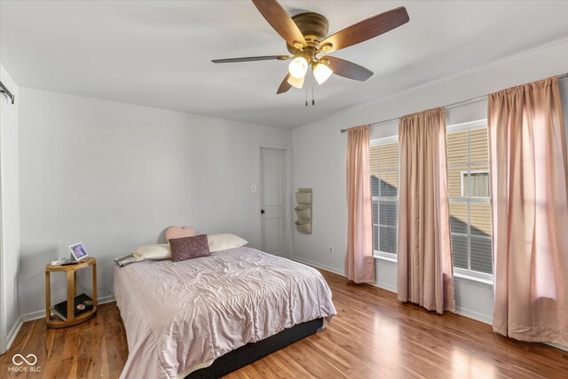 bedroom featuring hardwood / wood-style floors and ceiling fan