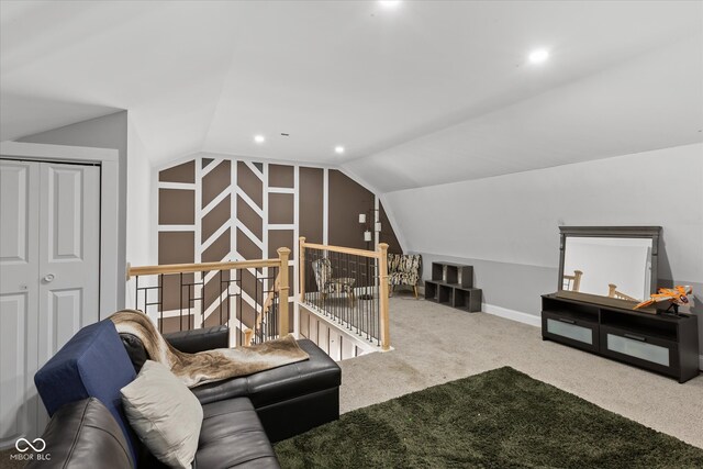 living room featuring carpet floors and lofted ceiling