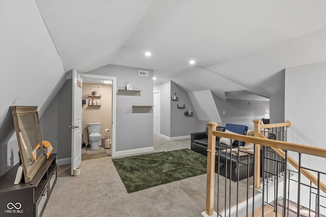 interior space featuring light carpet and lofted ceiling