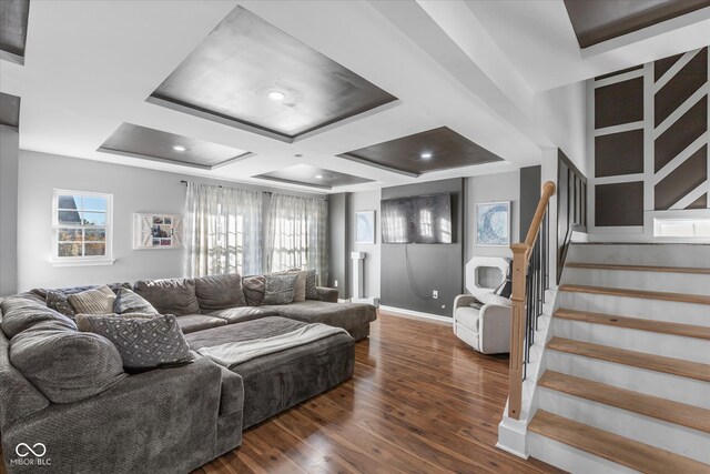 living room with beam ceiling, dark hardwood / wood-style floors, and coffered ceiling