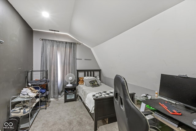 carpeted bedroom with lofted ceiling