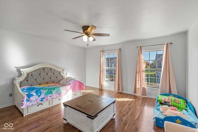 bedroom featuring ceiling fan and dark hardwood / wood-style floors