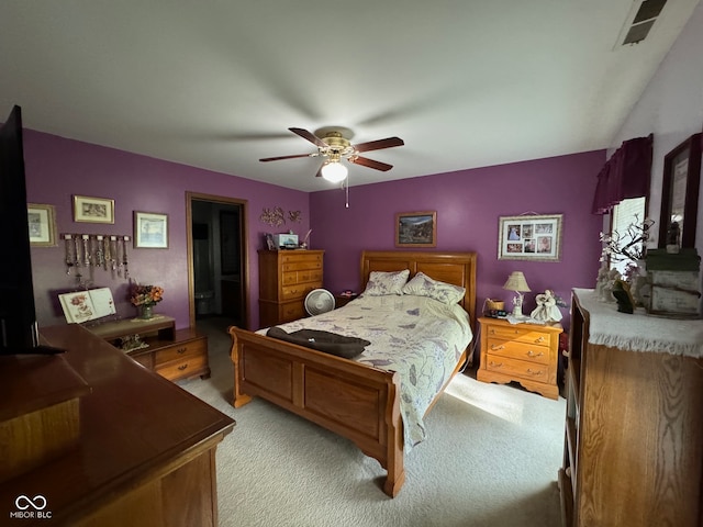 bedroom with light colored carpet and ceiling fan