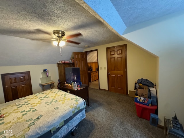 bedroom with lofted ceiling, a textured ceiling, ceiling fan, and carpet floors