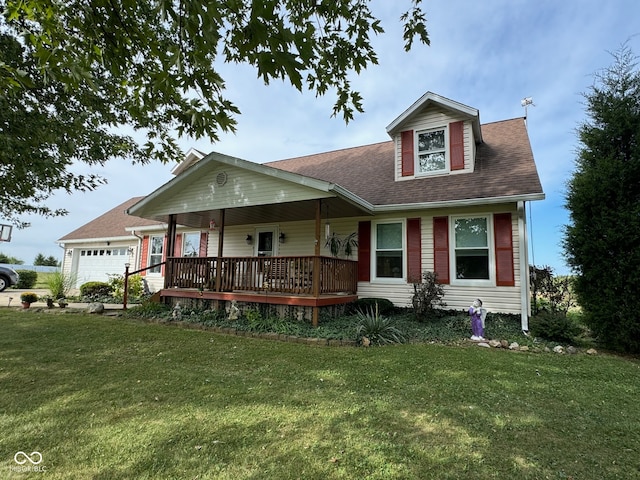 view of front of home with a front lawn, a garage, and covered porch