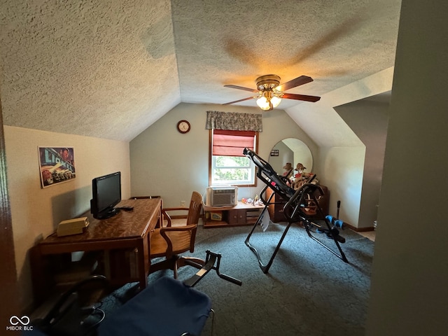 home office featuring carpet, lofted ceiling, a textured ceiling, and ceiling fan