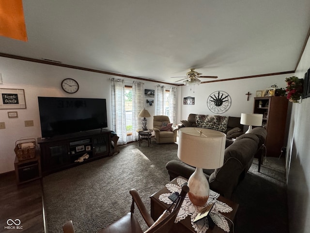 living room with dark hardwood / wood-style floors, ceiling fan, and crown molding