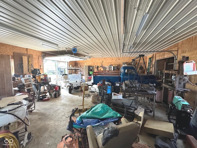 garage featuring wooden walls