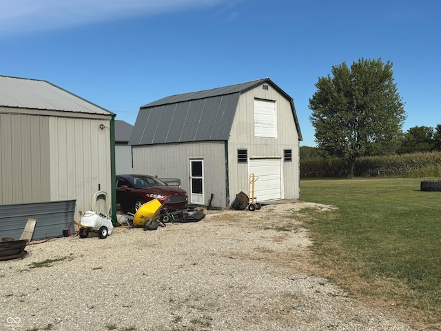 view of outbuilding featuring a lawn