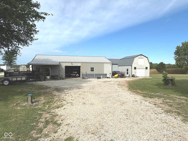 view of outbuilding featuring a lawn