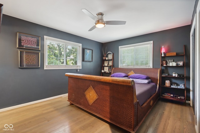 bedroom featuring wood-type flooring and ceiling fan