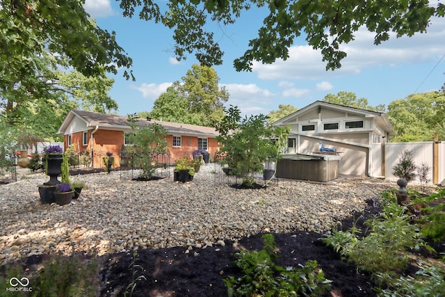 exterior space featuring a hot tub