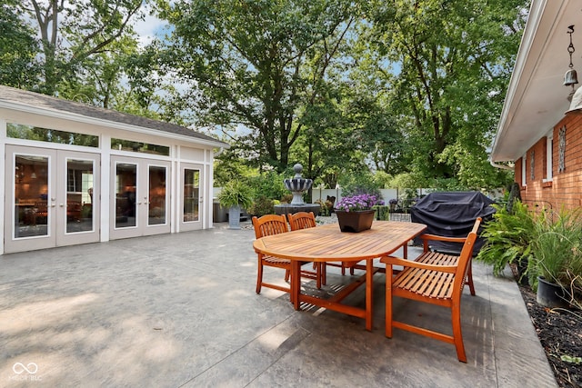 view of patio / terrace with a grill and french doors