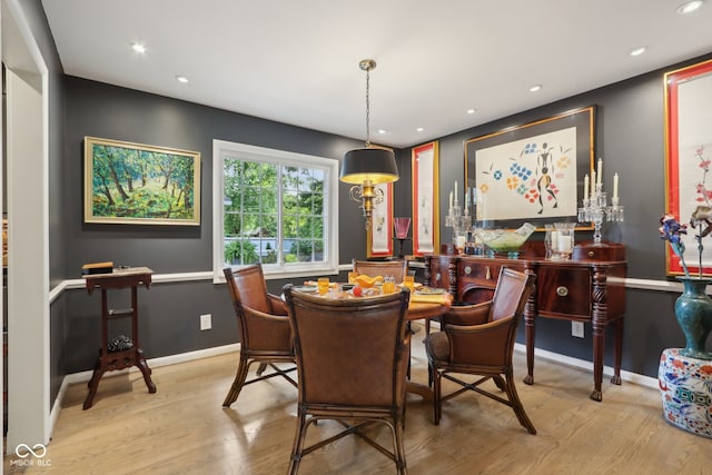 dining area with light hardwood / wood-style floors