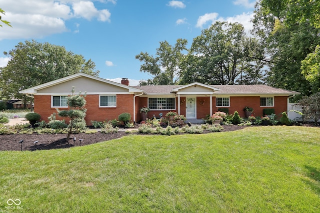 ranch-style house featuring a front lawn