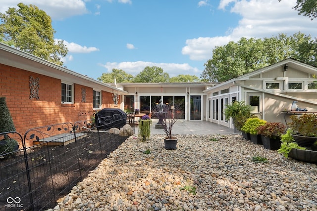 rear view of house with a patio area