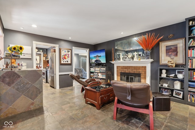 living room featuring a fireplace