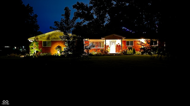 ranch-style house with a lawn