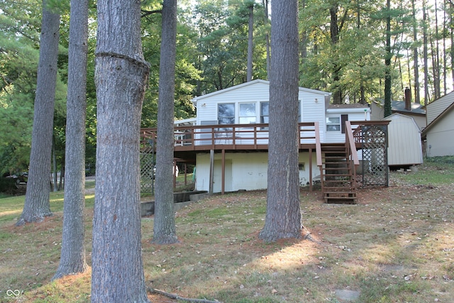 back of house with a deck