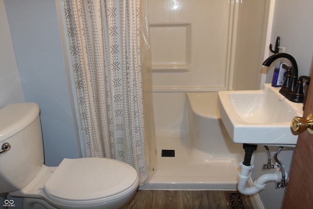 bathroom featuring toilet, a shower with curtain, sink, and wood-type flooring