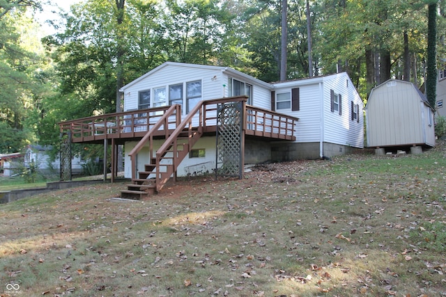 back of house featuring a shed and a deck