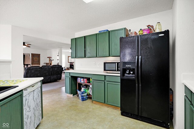 kitchen featuring ceiling fan, stainless steel appliances, and green cabinetry