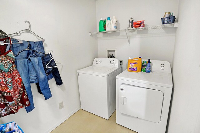 laundry area with washing machine and clothes dryer