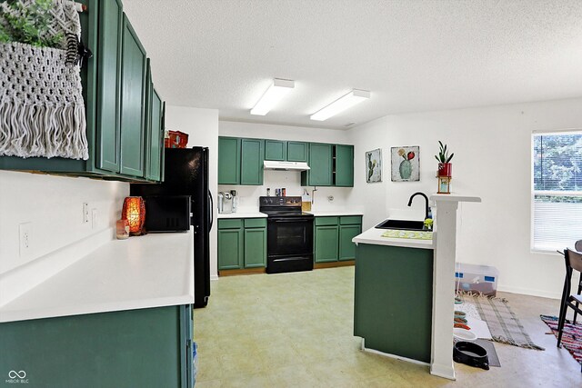 kitchen featuring sink, black appliances, a textured ceiling, and green cabinetry