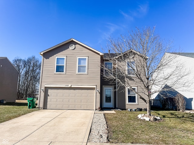 traditional-style home with a front lawn, an attached garage, and driveway