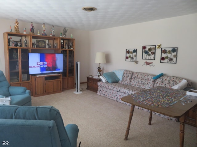 living room featuring visible vents and carpet flooring