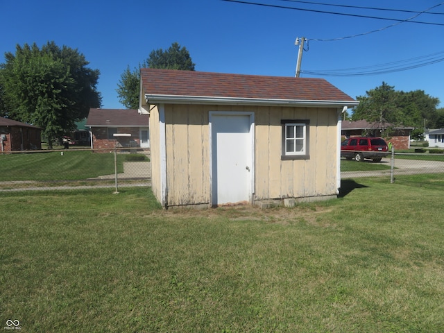 view of outbuilding featuring a lawn