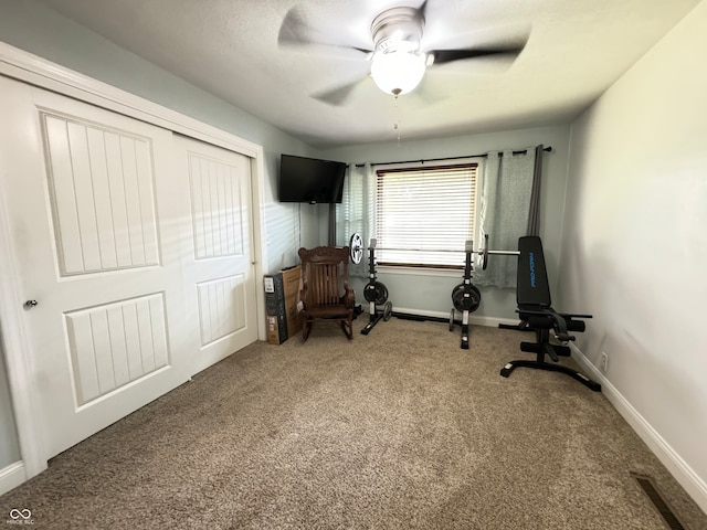 interior space with carpet flooring and ceiling fan