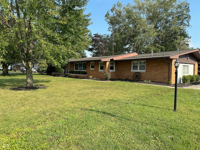 single story home with a front yard