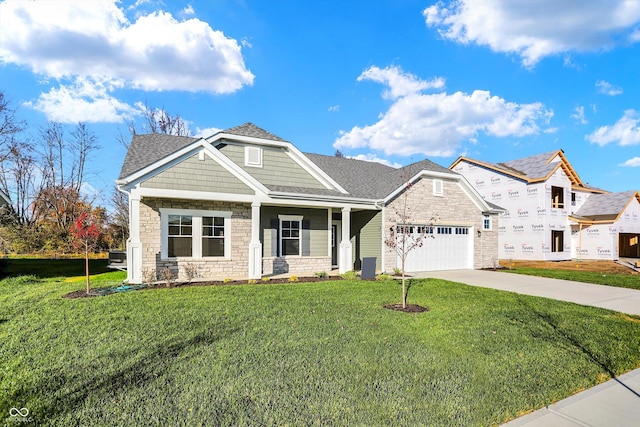 craftsman inspired home featuring a front yard and a garage