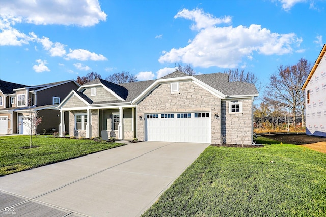 view of front of house with a front yard and a garage