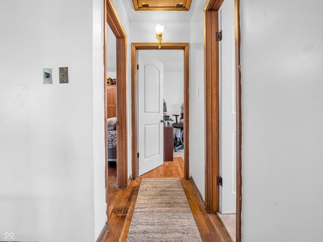 corridor with wood finished floors