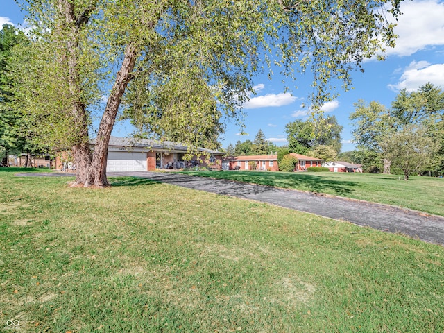 view of yard with a garage