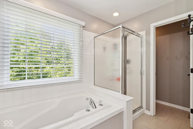 bathroom with plus walk in shower and tile patterned flooring