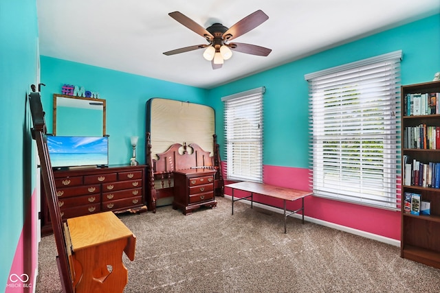 interior space with carpet flooring and ceiling fan