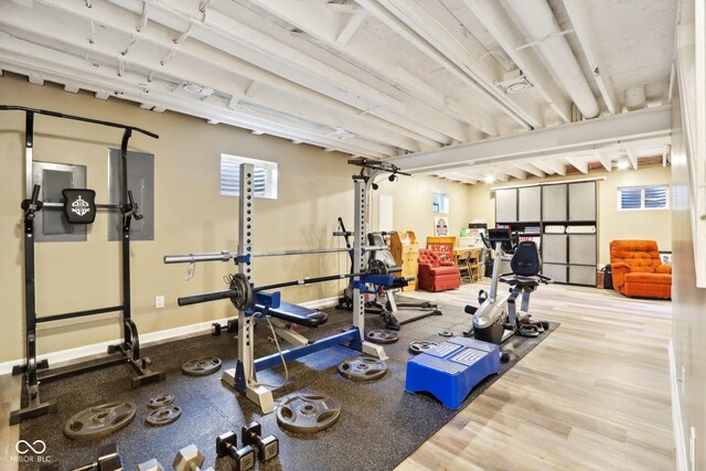 exercise room featuring wood-type flooring