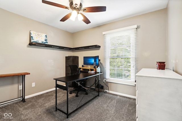 carpeted office featuring ceiling fan