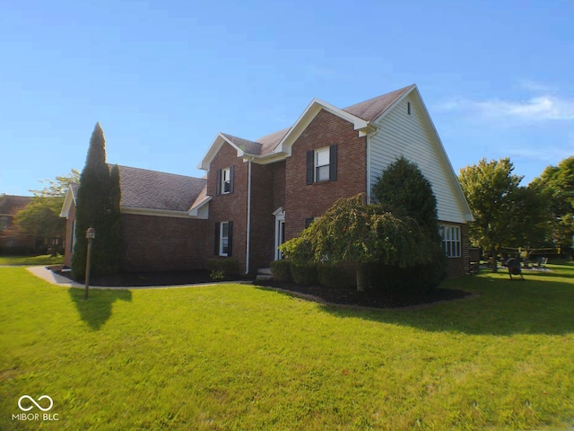 view of home's exterior featuring a yard