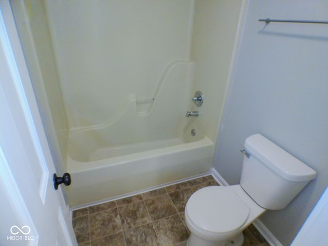 bathroom featuring toilet and shower / tub combination