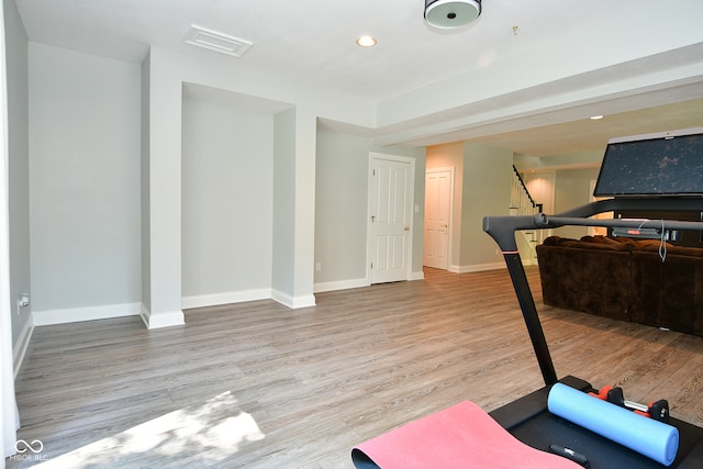 workout room featuring hardwood / wood-style flooring