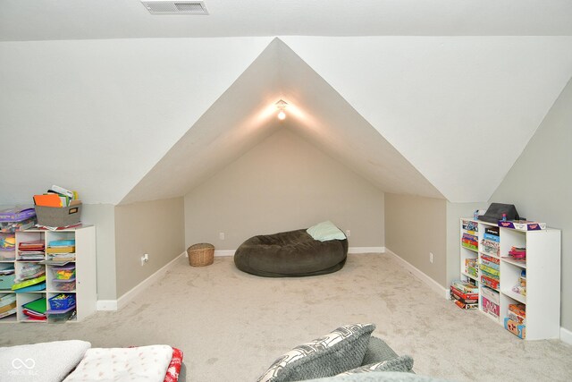 game room with carpet and vaulted ceiling