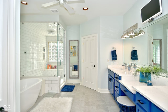 bathroom featuring a healthy amount of sunlight, ceiling fan, shower with separate bathtub, and vanity