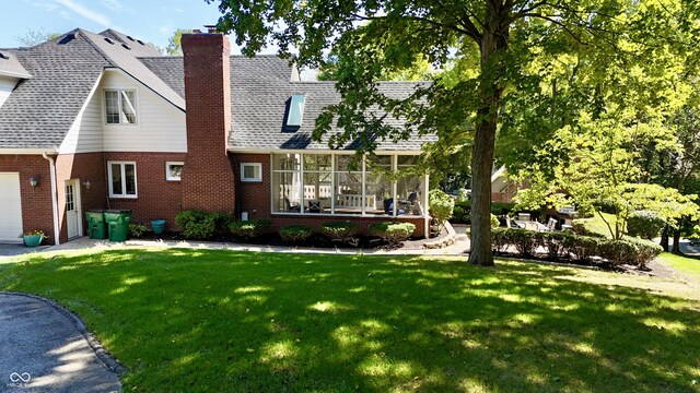 view of front facade with a front lawn and a garage