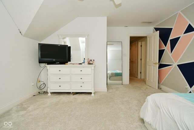 carpeted bedroom featuring vaulted ceiling