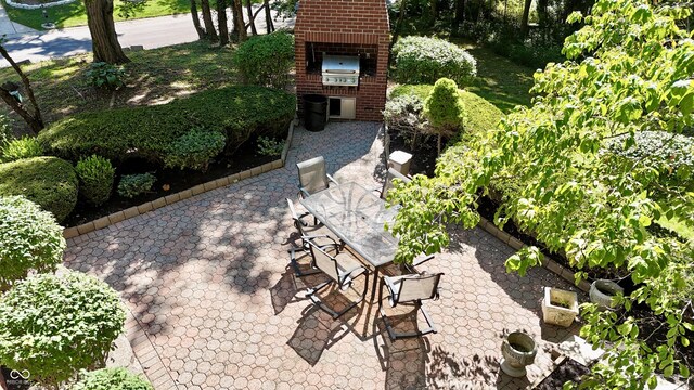 view of patio / terrace with an outdoor brick fireplace